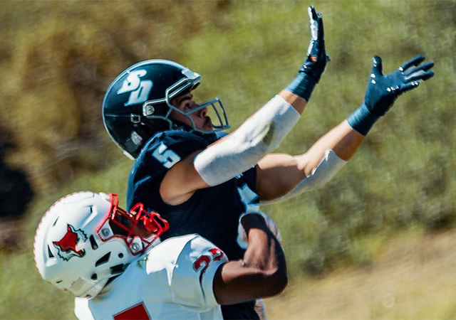 Toreros wide receiver Michael Bandy reaches for a pass in a recent USD football game.