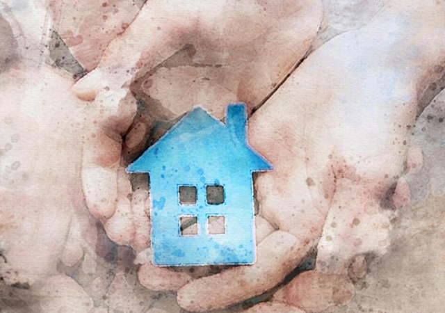 Watercolor image of two hands holding a blue house