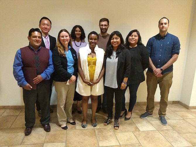 Aarti Ivanic, MBA academic director at USD School of Business, stands alongside MBA students, micro-entrepreneurs, Access Inc. partners,and USD faculty and staff