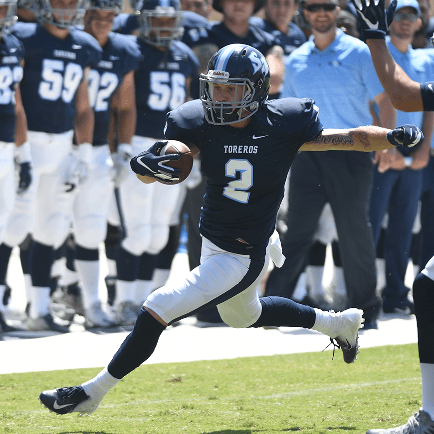 Christian Brooks runs with football