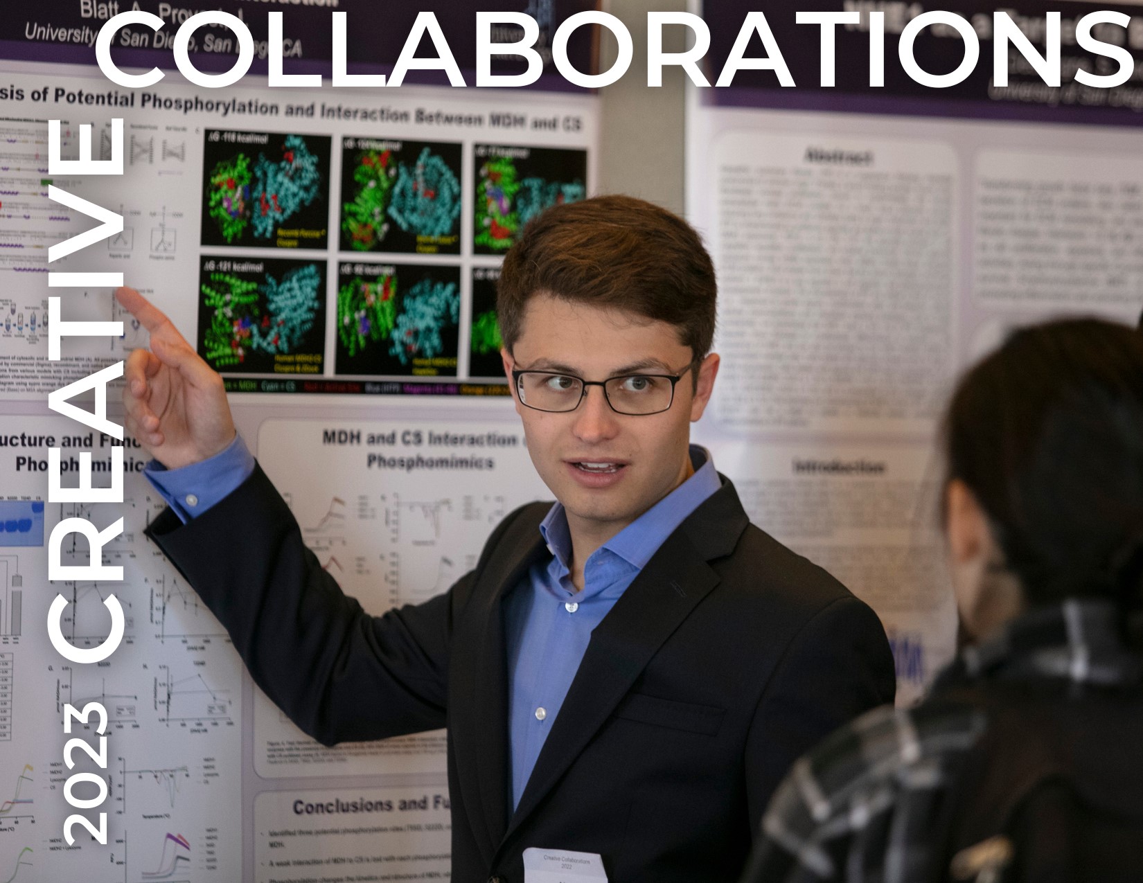 USD student presenting poster to another USD student.