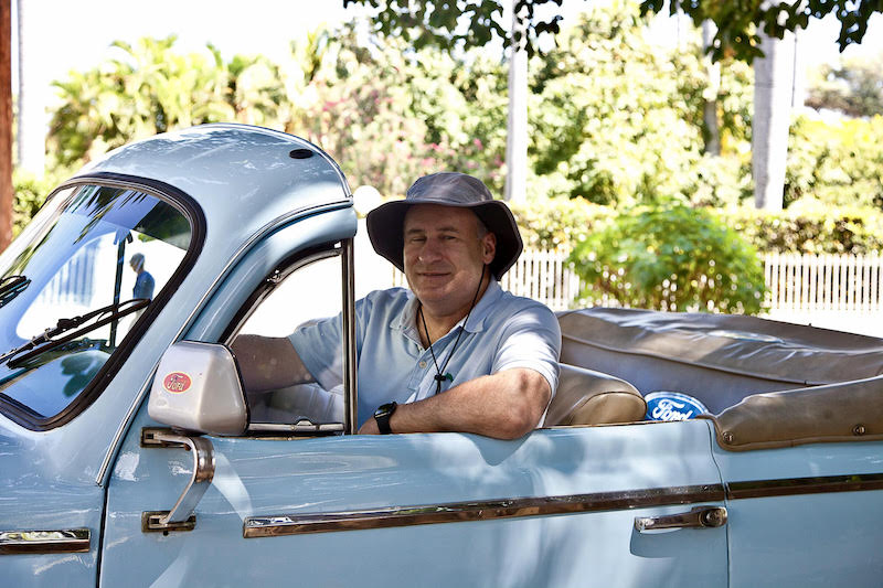 USD School of Business Board of Advisors Vice Chair, Rob MacKay, in a light blue vintage Ford auto
