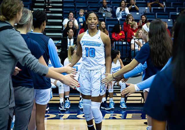 USD player high fiving