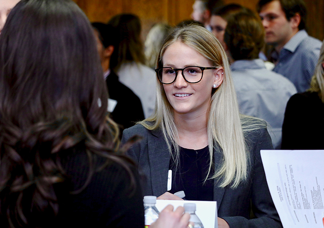 A person in conversation, networking