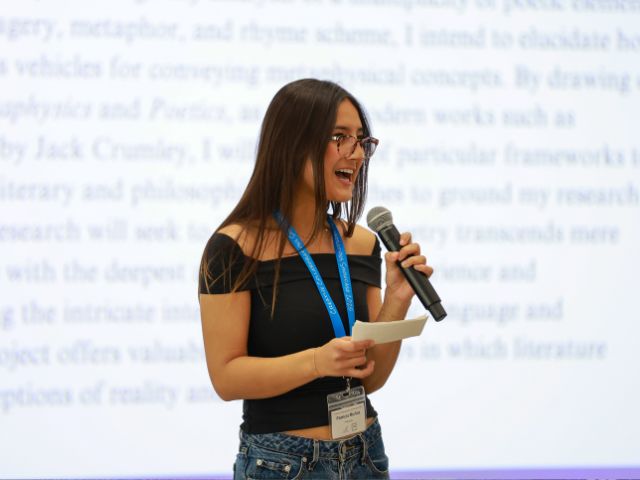 Student presenting at Creative Collaborations Showcase 2025.