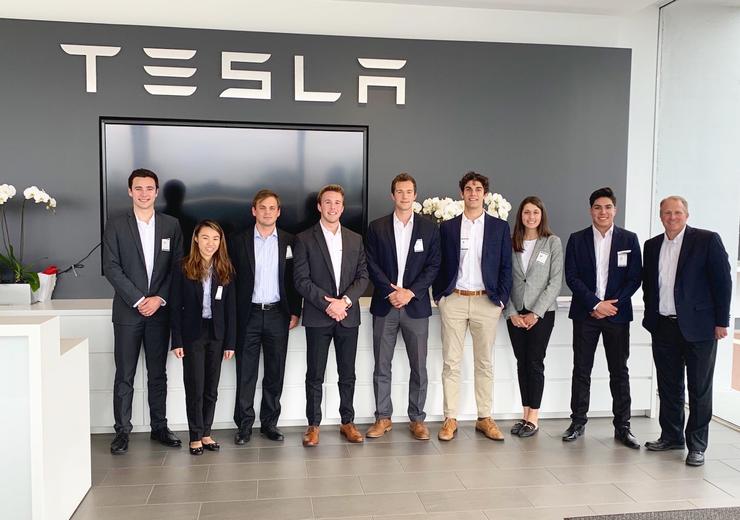 The USD SIBC Tesla student team smiles at Tesla headquarters in Fremont, CA