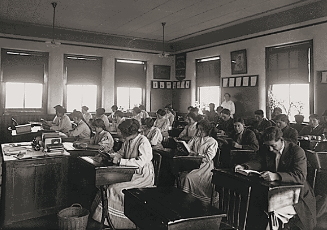 This is an old classroom in black and white.