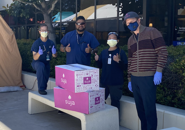 James Brennan and hospital staff with Suja boxes