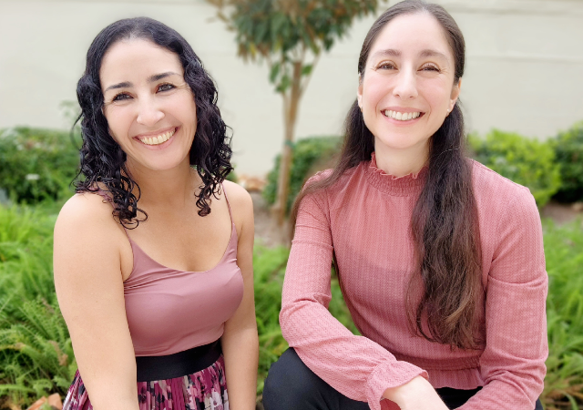 Gema and Maribel smiling outside