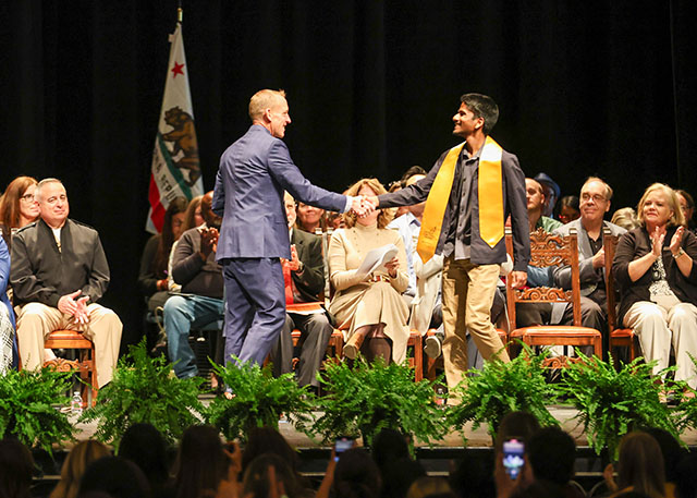 Michael Lovette Colyer presents award to student