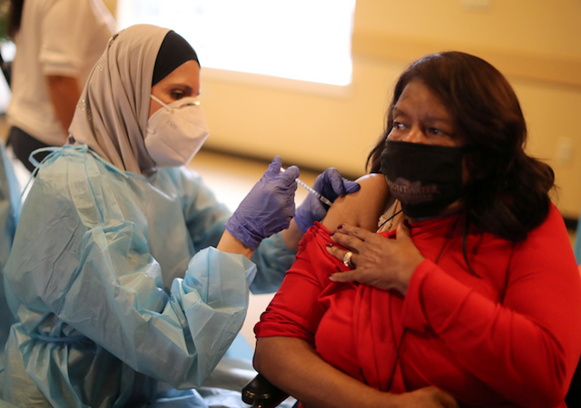 A woman received an injection of the COVID-19 vaccination at a senior center