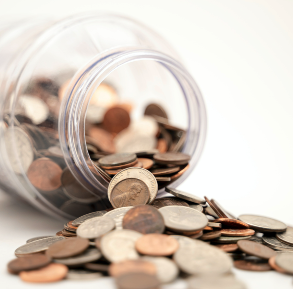 coins spilling out of a jar