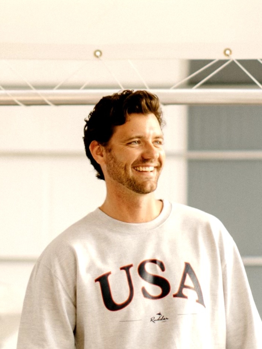Evan Workman wearing a USA sweatshirt