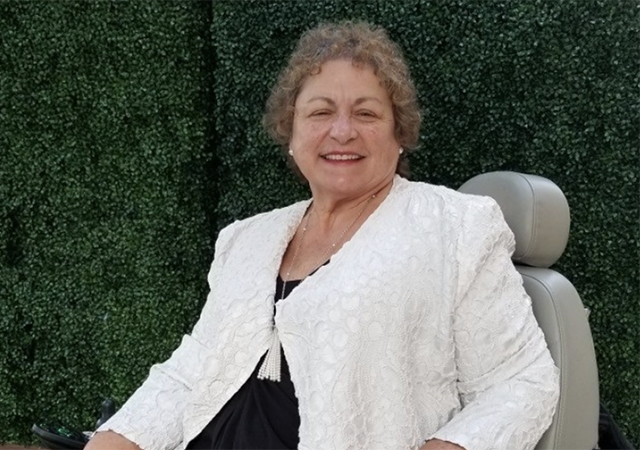 Image of Maria Arroyo seated and smiling