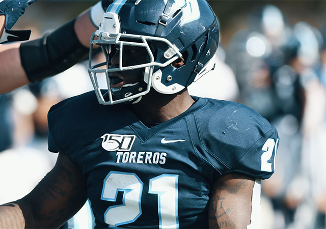 Toreros running back JoJo Binda Jr. is congratulated after scoring one of his three touchdowns in a win over Drake.