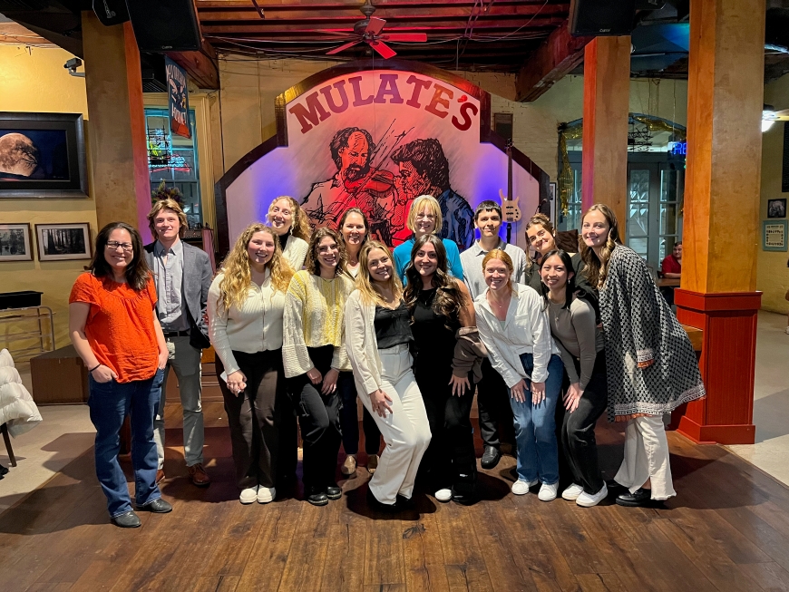 Group photo of students and faculty who attended OSM  at Mulate's restaurant in New Orleans