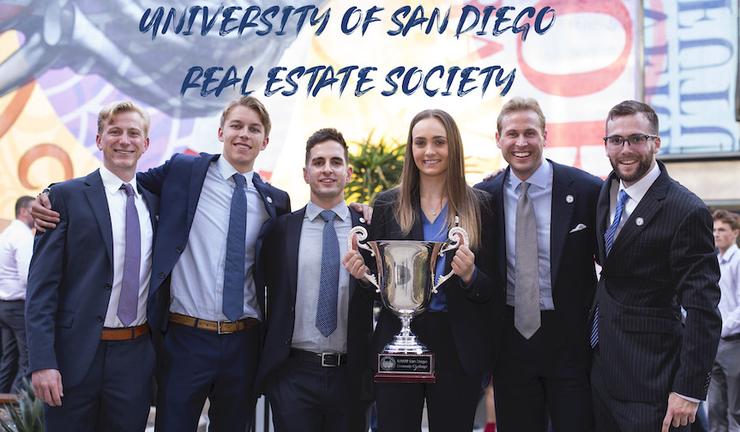 Picture of students holding trophy from the Real Estate Society