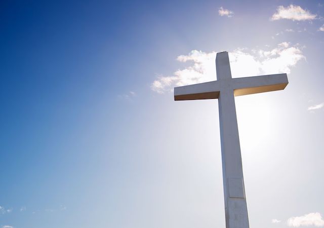 Image of a cross the blue sky
