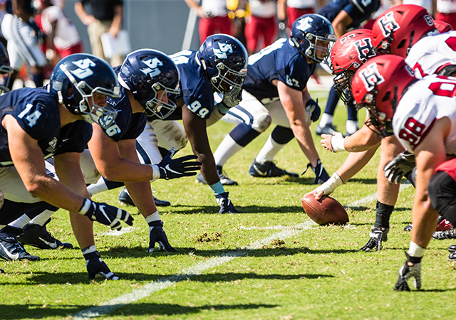 USD football players lined up