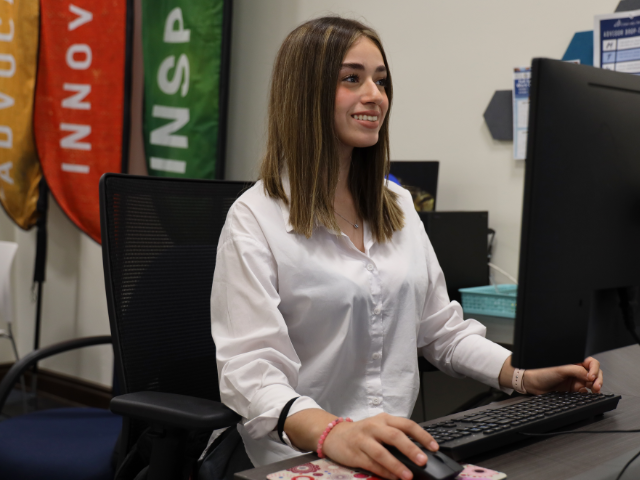 Cristo Rey student, Sofia Ramos, working at front desk