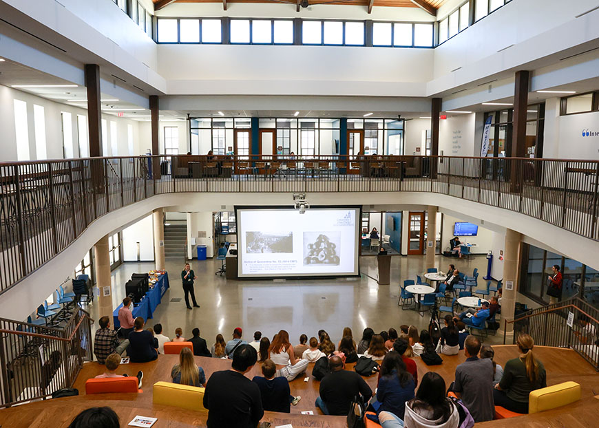 A student-presenter gives a talk during the 34th Creative Collaborations