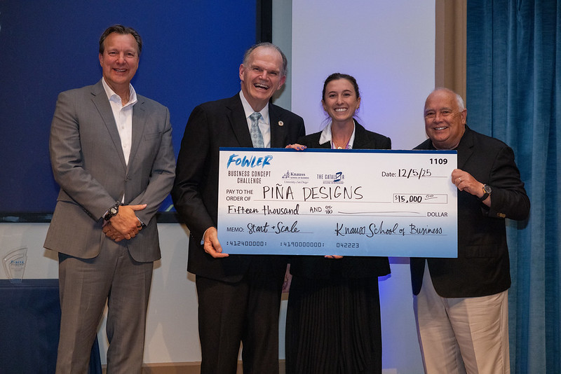 pina designs accepting their check 