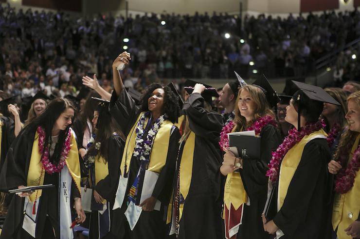 Students smiling at Commencement