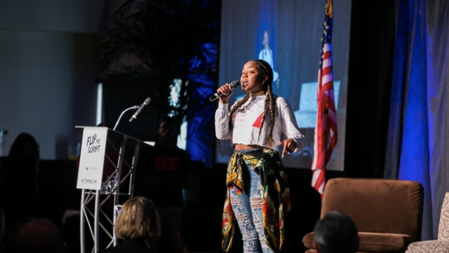 student speaking on stage