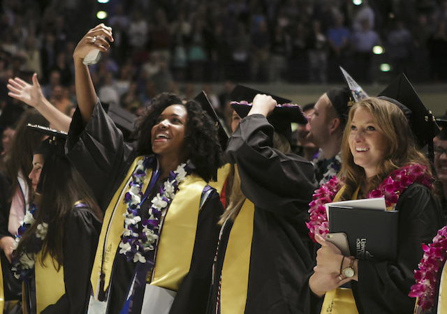 Students smiling at Commencement