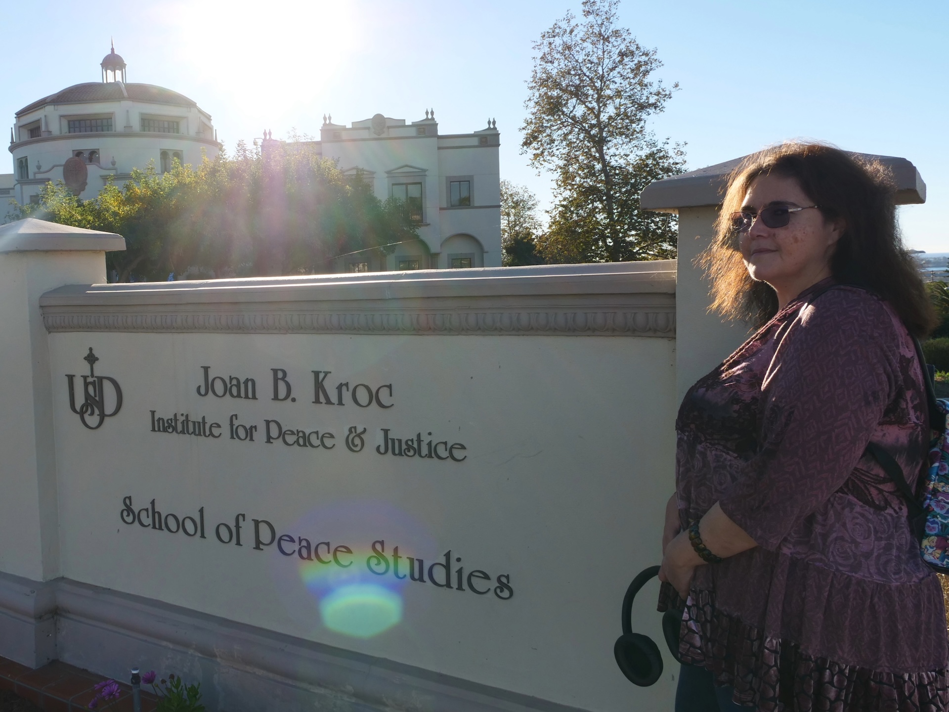 Charlotte Iradjpanah in front of Joan B. Kroc School of Peace Studies