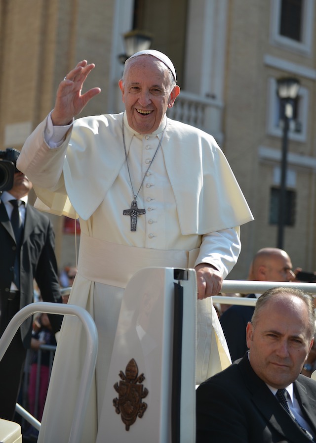 Pope Francis standing and waving