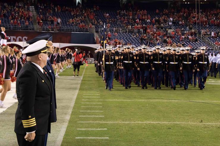 Standing at attention for the National Anthem.