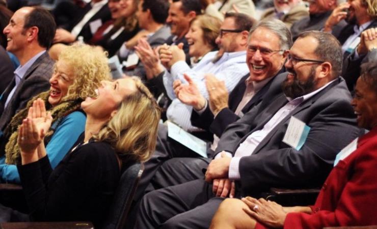 laughing crowd in auditorium