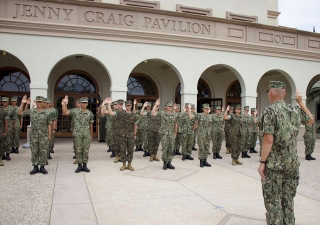 Captain Olin swears in the new members of the unit as Midshipmen in front of the Jenny Craig Pavilion.