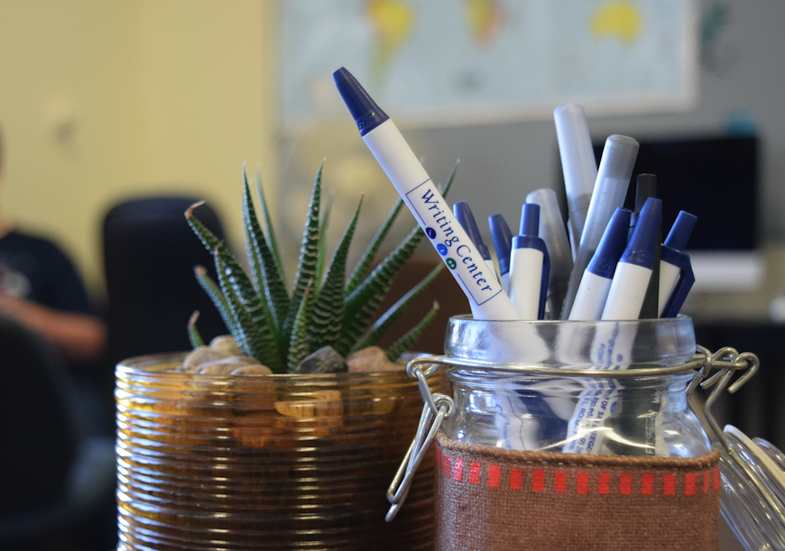 Plant and jar of pens