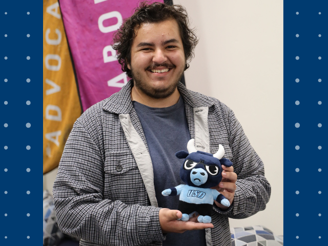 A picture of Jonas Bimshas holding a plush toy