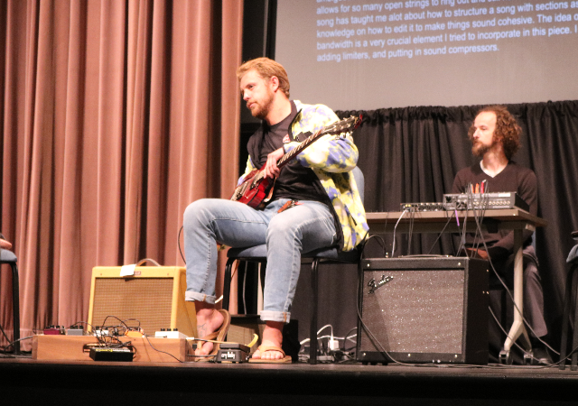 A Digital Audio Composition student performs on stage in Shiley Theatre.