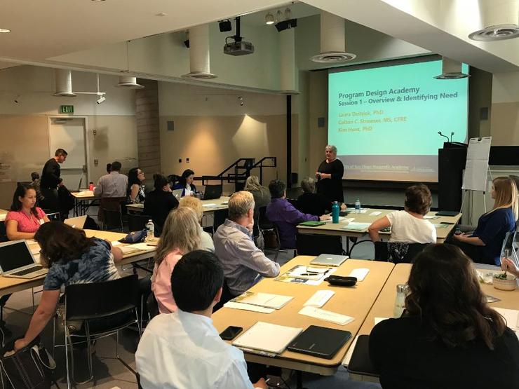 classroom full of professionals looking at a PowerPoint