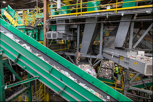 Mixed plastics are conveyed toward an optical sorter at a recycling plant. The industry is going through rapid changes, making it sometimes confusing for consumers.