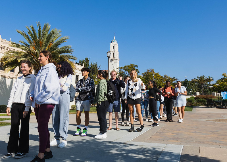 Business students gather in a line on University of San Diego campus