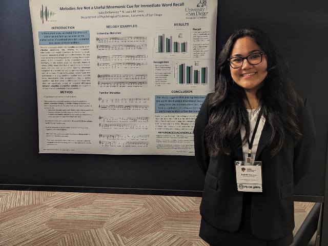 Isabella Ramirez in front of her research poster 