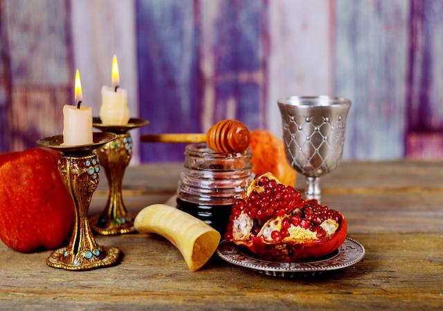 Table adorned with candles  for Rosh Hashanah holiday