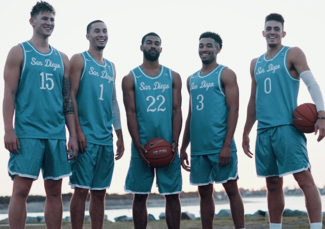 Men's basketball team poses as group