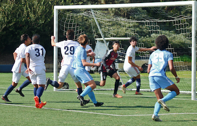 Men's Club Soccer playing on turf field