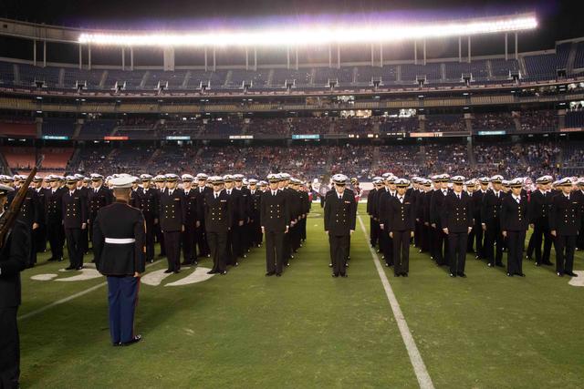 Standing at attention for the National Anthem.