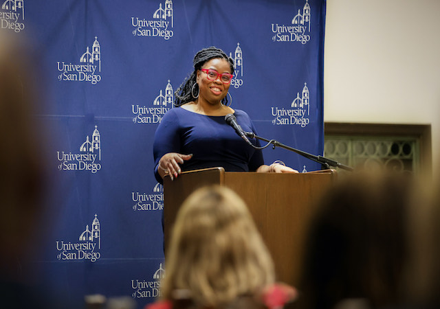Candace Mary Benbow at podium during lecture