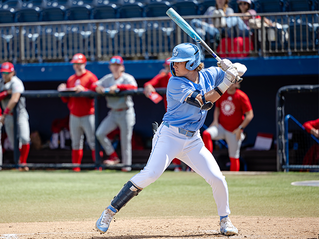 Austin Smith hitting a baseball