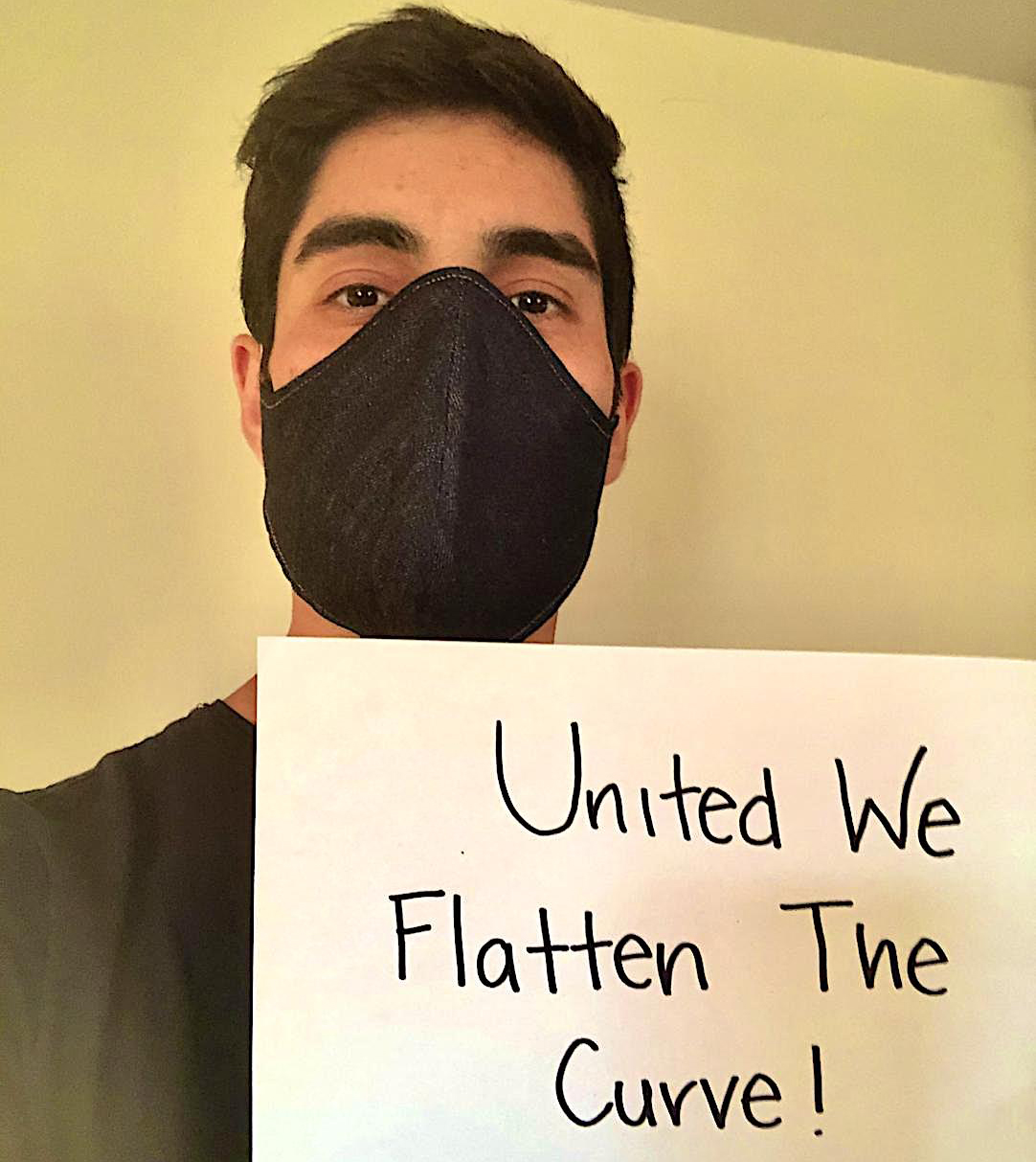 Engineering student Eric Estrada wears a mask similar to the 80 he had made and donated to members of the San Diego Blind Community Center.