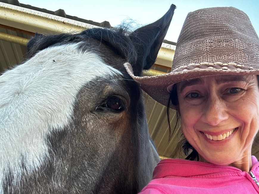 Dr. Lynn McGrath with one of her horses. 