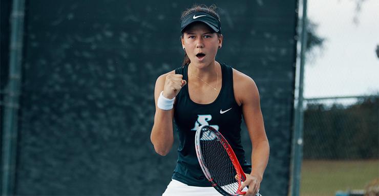 USD women's tennis player Sophia Chow celebrates after winning a point. Chow helped her team clinch its 12th match victory in a row on April 7 against host Santa Clara.